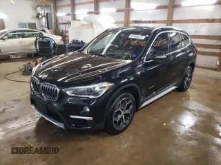 2017 BMW X1 xDrive28i with VIN WBXHT3C34H5F87048, listed as a Copart auction lot 67545012 with 76,666 mi miles. Bid and sale history available at carsss.com. Image 1.