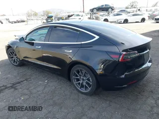 2019 Tesla Model 3 Mid Range with VIN 5YJ3E1EA1KF410297, listed as a IAAI auction lot 41841991 with 176,254 mi miles. Bid and sale history available at carsss.com. Image 3.
