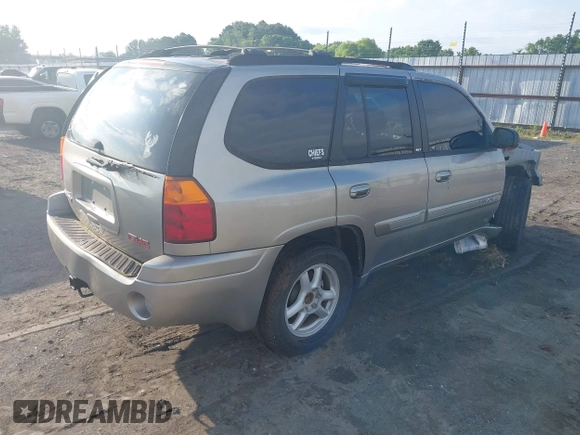 2002 GMC Envoy SLE z VIN 1GKDS13S122357410, wystawiony jako IAAI lot #42355556 z przebiegiem Nie podano mil oraz . Historia ofert i sprzedaży dostępna na DreamBid. Obrazek 4.