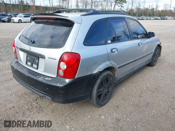 2002 Mazda Protege with VIN JM1BJ245921455563, listed as a IAAI auction lot 42064853 with Not Provided miles and . Bid and sale history available at DreamBid. Image 4.