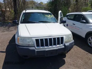 2004 Jeep Grand Cherokee Laredo with VIN 1J4GW48S54C314056, listed as a IAAI auction lot 42096065 with 164,113 mi miles. Bid and sale history available at carsss.com. Image 6.