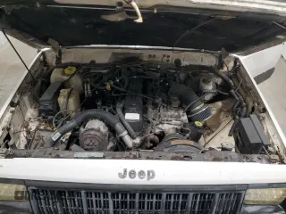 1996 Jeep Cherokee Sport with VIN 1J4FJ68S5TL235927, listed as a Copart auction lot 68942174 with 238,619 mi miles and Clean Title. Bid and sale history available at carsss.com. Image 12.