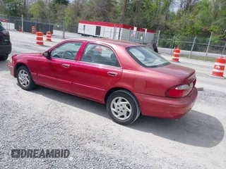2000 Mazda 626 LX with VIN 1YVGF22C8Y5115891, listed as a IAAI auction lot 42121137 with 186,165 mi miles. Bid and sale history available at carsss.com. Image 3.