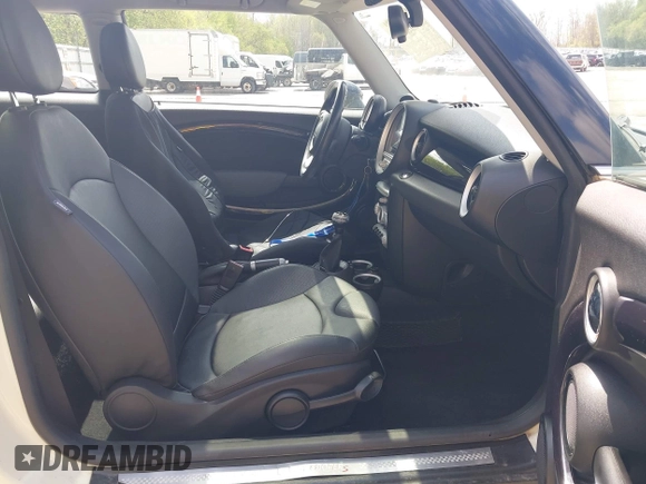 2007 MINI Hardtop S with VIN WMWMF73567TT84033, listed as a IAAI auction lot 42189573 with 75,177 mi miles and . Bid and sale history available at DreamBid. Image 5.
