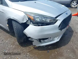2017 Ford Focus SE with VIN 1FADP3FE4HL295573, listed as a IAAI auction lot 39562568 with 96,939 mi miles and . Bid and sale history available at carsss.com. Image 18.