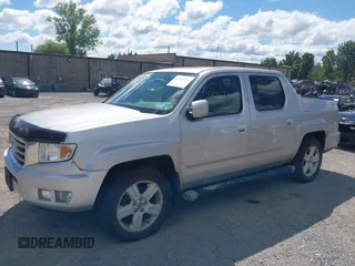 2013 Honda Ridgeline RTL with VIN 5FPYK1F51DB007236, listed as a IAAI auction lot 42762126 with 201,758 mi miles and . Bid and sale history available at DreamBid. Image 2.