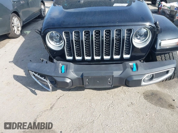 2023 Jeep Wrangler Sahara with VIN 1C4JJXP67PW556933, listed as a IAAI auction lot 41587035 with 20,463 mi miles and . Bid and sale history available at DreamBid. Image 6.