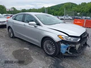2013 Ford Fusion Titanium Hybrid with VIN 3FA6P0RU3DR281914, listed as a IAAI auction lot 42380838 with 166,956 mi miles and . Bid and sale history available at DreamBid. Image 1.