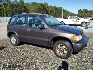 2000 Kia Sportage with VIN KNDJB7237Y5683960, listed as a Copart auction lot 75192944 with 127,615 mi miles and Salvage Title. Bid and sale history available at carsss.com. Image 4.