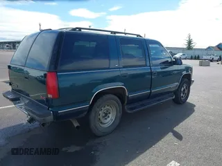 1999 GMC Yukon with VIN 1GKEK13R3XJ717999, listed as a IAAI auction lot 41870187 with 179,855 mi miles. Bid and sale history available at carsss.com. Image 4.