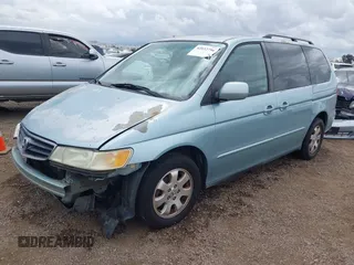 2004 Honda Odyssey EX-L with VIN 5FNRL18064B060817, listed as a IAAI auction lot 42032796 with 200,999 mi miles and . Bid and sale history available at DreamBid. Image 2.