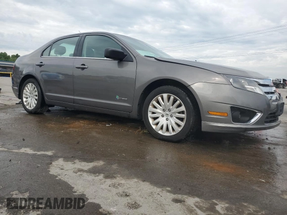 2012 Ford Fusion Hybrid z VIN 3FADP0L33CR211609, wystawiony jako Copart lot #60873005 z przebiegiem 144 474 mil mil oraz Szkoda całkowita • Salvage title. Historia ofert i sprzedaży dostępna na DreamBid. Obrazek 4.