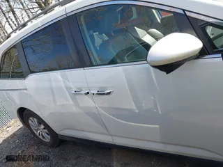 2016 Honda Odyssey EX-L with VIN 5FNRL5H62GB051628, listed as a IAAI auction lot 41911509 with 128,281 mi miles. Bid and sale history available at carsss.com. Image 13.