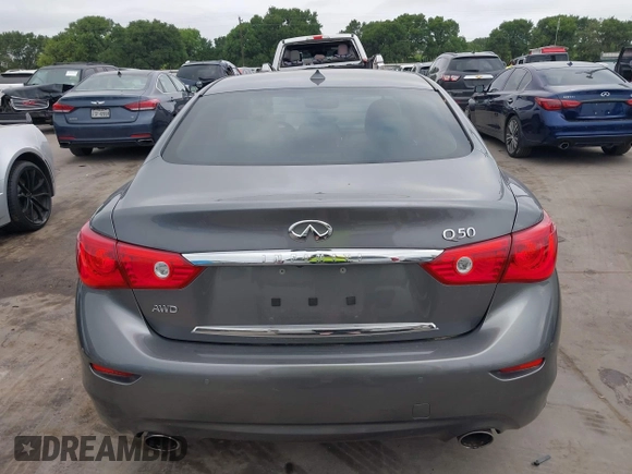 2015 Infiniti Q50 Premium z VIN JN1BV7AR7FM408015, wystawiony jako IAAI lot #42083301 z przebiegiem 58 817 mil mil oraz . Historia ofert i sprzedaży dostępna na DreamBid. Obrazek 16.