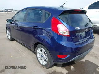 2016 Ford Fiesta SE with VIN 3FADP4EJ4GM199945, listed as a IAAI auction lot 41881260 with 98,945 mi miles. Bid and sale history available at carsss.com. Image 3.