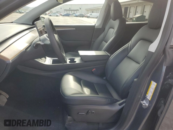 2023 Tesla Model Y Long Range with VIN 7SAYGDEE2PA024693, listed as a Copart auction lot 52595935 with 35,179 mi miles and Salvage Title. Bid and sale history available at DreamBid. Image 7.