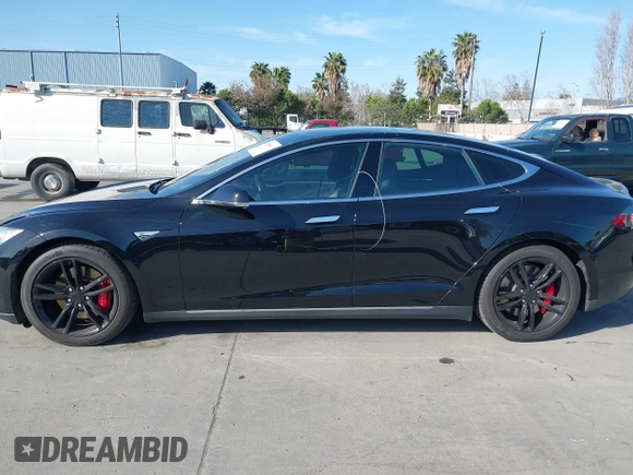 2014 Tesla Model S P85D with VIN 5YJSA1H22EFP65530, listed as a IAAI auction lot 41959941 with 76,532 mi miles and . Bid and sale history available at DreamBid. Image 14.