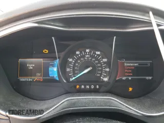 2016 Ford Fusion Titanium z VIN 3FA6P0K98GR151640, wystawiony jako Copart lot #73254594 z przebiegiem 145 473 mil mil oraz Szkoda całkowita • Salvage title. Historia ofert i sprzedaży dostępna na DreamBid. Obrazek 9.