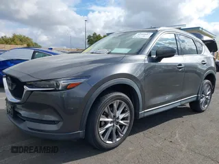 2021 Mazda CX-5 Grand Touring with VIN JM3KFADM2M1340669, listed as a IAAI auction lot 41916687 with 83,872 mi miles. Bid and sale history available at carsss.com. Image 20.