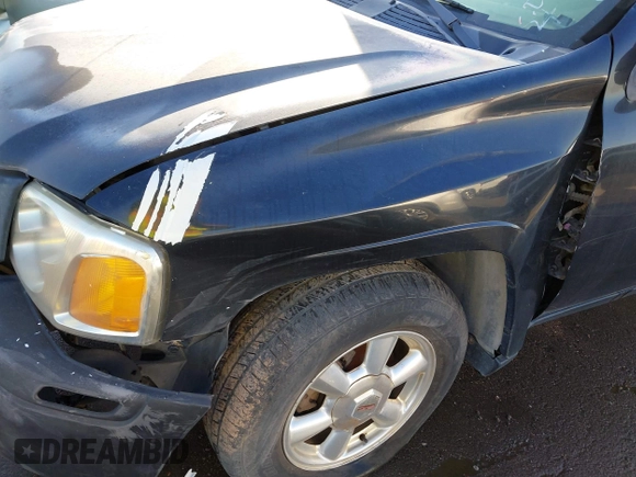 2005 GMC Envoy SLE with VIN 1GKDT13S752161375, listed as a IAAI auction lot 40945627 with 172,757 mi miles. Bid and sale history available at carsss.com. Image 12.