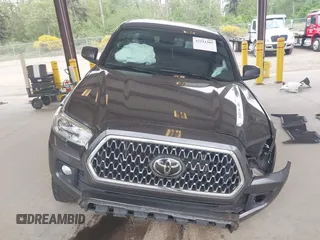 2019 Toyota Tacoma SR z VIN 3TMCZ5AN1KM257081, wystawiony jako IAAI lot #42211385 z przebiegiem 60 229 mil mil oraz . Historia ofert i sprzedaży dostępna na DreamBid. Obrazek 13.