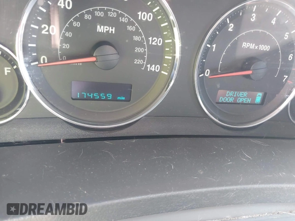 2007 Jeep Grand Cherokee Laredo with VIN 1J8GR48K57C618529, listed as a IAAI auction lot 42139566 with 174,559 mi miles. Bid and sale history available at carsss.com. Image 7.