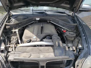 2012 BMW X5 35i z VIN 5UXZV4C55CL753810, wystawiony jako Copart lot #62405565 z przebiegiem 178 504 mil mil oraz Szkoda całkowita • Salvage title. Historia ofert i sprzedaży dostępna na DreamBid. Obrazek 12.