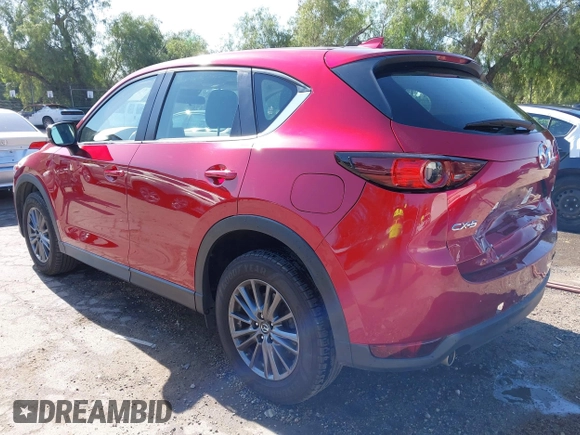2019 Mazda CX-5 Sport with VIN JM3KFABM0K1633065, listed as a IAAI auction lot 41968786 with 90,407 mi miles and . Bid and sale history available at DreamBid. Image 3.