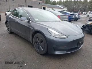 2019 Tesla Model 3 Mid Range with VIN 5YJ3E1EA3KF307415, listed as a IAAI auction lot 41673239 with 42,895 mi miles and . Bid and sale history available at DreamBid. Image 1.