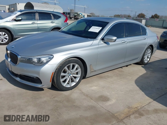 2016 BMW 7 Series 740i with VIN WBA7E2C5XGG739099, listed as a IAAI auction lot 41526038 with 123,900 mi miles. Bid and sale history available at carsss.com. Image 18.