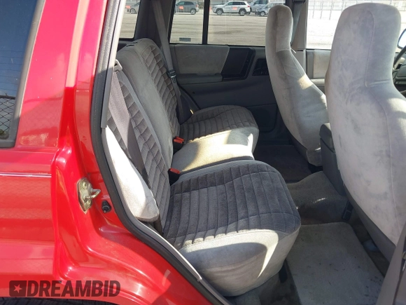 1995 Jeep Grand Cherokee Laredo with VIN 1J4FX58S9SC686074, listed as a IAAI auction lot 42451786 with 82,249 mi miles and . Bid and sale history available at DreamBid. Image 8.