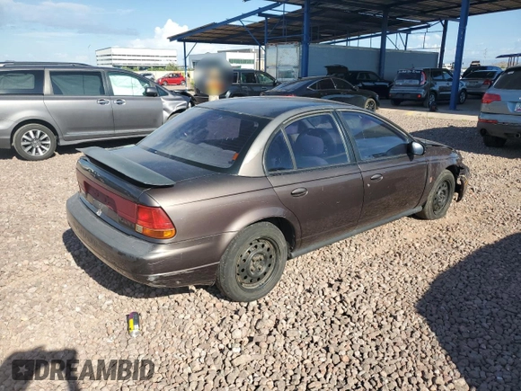 1999 Saturn SL with VIN 1G8ZK527XXZ136922, listed as a Copart auction lot 86704404 with 134,897 mi miles and Salvage Title. Bid and sale history available at carsss.com. Image 3.