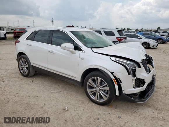 2024 Cadillac XT5 FWD Premium Luxury with VIN 1GYKNCRS9RZ706158, listed as a Copart auction lot 60455055 with 7,999 mi miles and Salvage title. Bid and sale history available at DreamBid. Image 4.