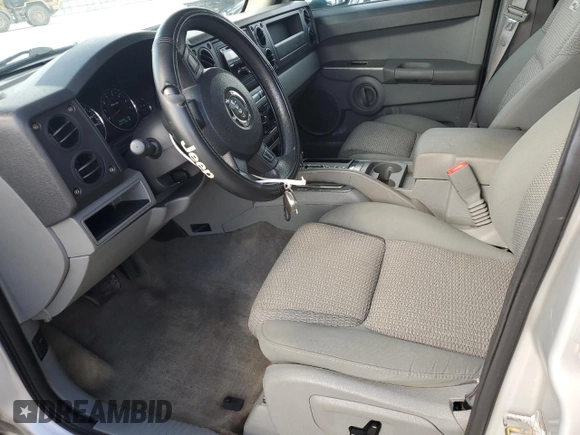 2006 Jeep Commander with VIN 1J8HH48K96C289162, listed as a Copart auction lot 80979074 with 170,581 mi miles and Salvage title. Bid and sale history available at DreamBid. Image 7.