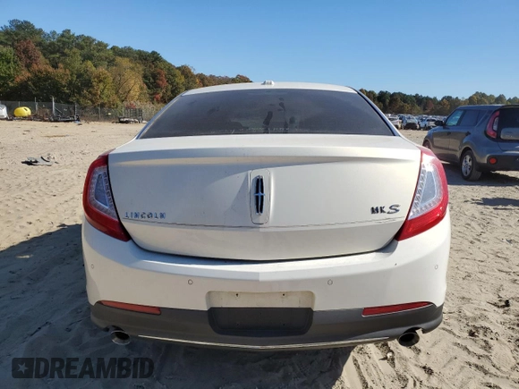 2013 Lincoln MKS z VIN 1LNHL9DK0DG605400, wystawiony jako Copart lot #77071034 z przebiegiem 73 450 mil mil oraz Szkoda całkowita • Salvage title. Historia ofert i sprzedaży dostępna na DreamBid. Obrazek 6.
