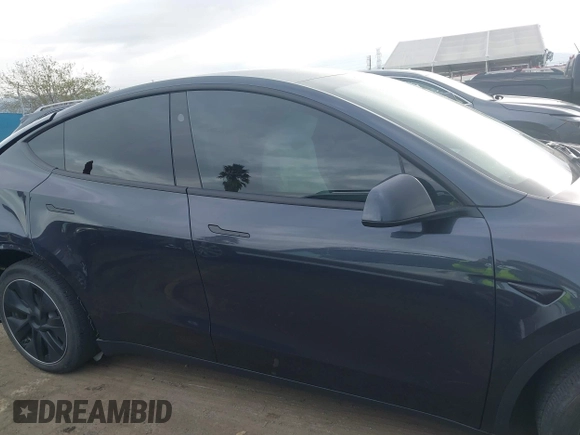 2024 Tesla Model Y with VIN 7SAYGDED8RF116209, listed as a IAAI auction lot 41761804 with 12,048 mi miles and . Bid and sale history available at DreamBid. Image 13.