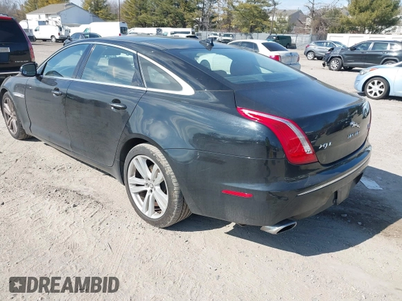 2013 Jaguar XJ Portfolio with VIN SAJWJ2GDXD8V55879, listed as a IAAI auction lot 41568366 with 121,119 mi miles and . Bid and sale history available at DreamBid. Image 3.