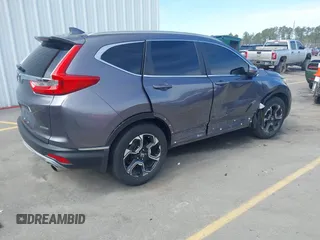 2018 Honda CR-V Touring with VIN 7FARW1H9XJE018575, listed as a IAAI auction lot 41747192 with 83,699 mi miles and . Bid and sale history available at carsss.com. Image 4.