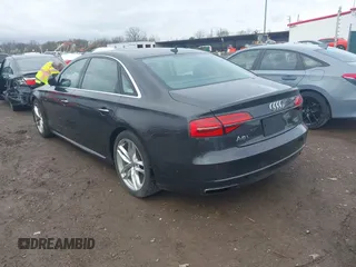 2016 Audi A8 L 4.0T Sport with VIN WAU43AFD3GN020763, listed as a IAAI auction lot 41951858 with 104,563 mi miles. Bid and sale history available at carsss.com. Image 3.