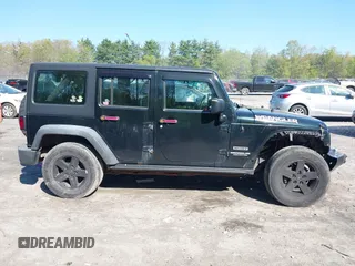 2012 Jeep Wrangler Unlimited Sport z VIN 1C4BJWDG1CL220511, wystawiony jako IAAI lot #42227037 z przebiegiem 157 914 mil mil oraz . Historia ofert i sprzedaży dostępna na DreamBid. Obrazek 13.