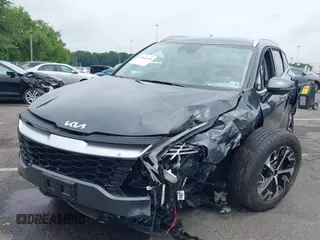 2023 Kia Sportage EX with VIN KNDPVCAG1P7110909, listed as a IAAI auction lot 42646436 with 16,304 mi miles and . Bid and sale history available at DreamBid. Image 2.