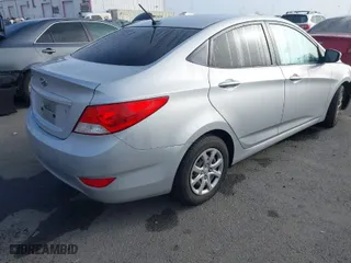 2014 Hyundai Accent GLS with VIN KMHCT4AE6EU586785, listed as a IAAI auction lot 41674060 with 135,355 mi miles. Bid and sale history available at carsss.com. Image 4.