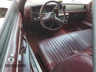 1984 GMC Caballero z VIN 1GTCW80HXER501304, wystawiony jako Copart lot #68697714 z przebiegiem 436 532 mil mil oraz Tytuł czysty. Historia ofert i sprzedaży dostępna na DreamBid. Obrazek 8.