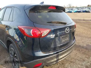 2016 Mazda CX-5 Grand Touring with VIN JM3KE4DY1G0823989, listed as a IAAI auction lot 41770149 with 40,677 mi miles. Bid and sale history available at carsss.com. Image 16.