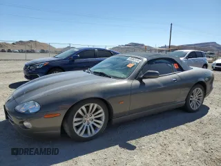 2005 Jaguar XK with VIN SAJDA42C452A41017, listed as a Copart auction lot 65583134 with 143,024 mi miles and Salvage Title. Bid and sale history available at carsss.com. Image 1.
