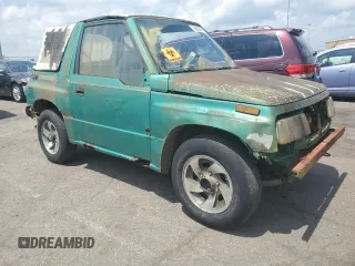 1994 Geo Tracker z VIN 2CNBE18U4R6933505, wystawiony jako Copart lot #68421924 z przebiegiem 203 558 mil mil oraz Szkody całkowita. Historia ofert i sprzedaży dostępna na DreamBid. Obrazek 4.