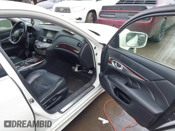2013 Infiniti M with VIN JN1BY1AP2DM511813, listed as a IAAI auction lot 41577968 with 191,608 mi miles and . Bid and sale history available at DreamBid. Image 5.