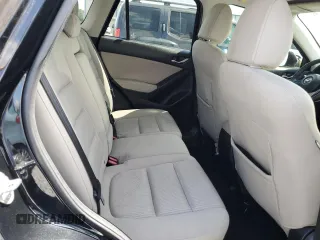 2014 Mazda CX-5 Touring z VIN JM3KE2CY8E0326988, wystawiony jako Copart lot #60473715 z przebiegiem 231 055 mil mil oraz Czysty tytuł • Clean title. Historia ofert i sprzedaży dostępna na DreamBid. Obrazek 11.