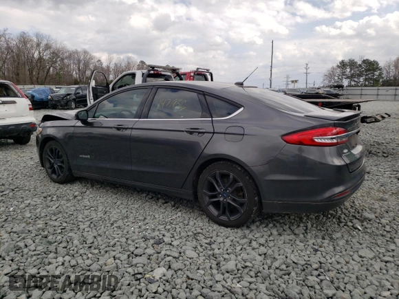 2018 Ford Fusion Hybrid SE with VIN 3FA6P0LU5JR241824, listed as a Copart auction lot 42303303 with 147,956 mi miles. Bid and sale history available at carsss.com. Image 2.