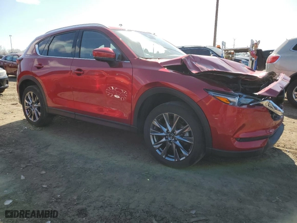 2021 Mazda CX-5 Signature with VIN JM3KFBEYXM0434778, listed as a Copart auction lot 51980255 with 34,283 mi miles and Salvage Title. Bid and sale history available at carsss.com. Image 4.